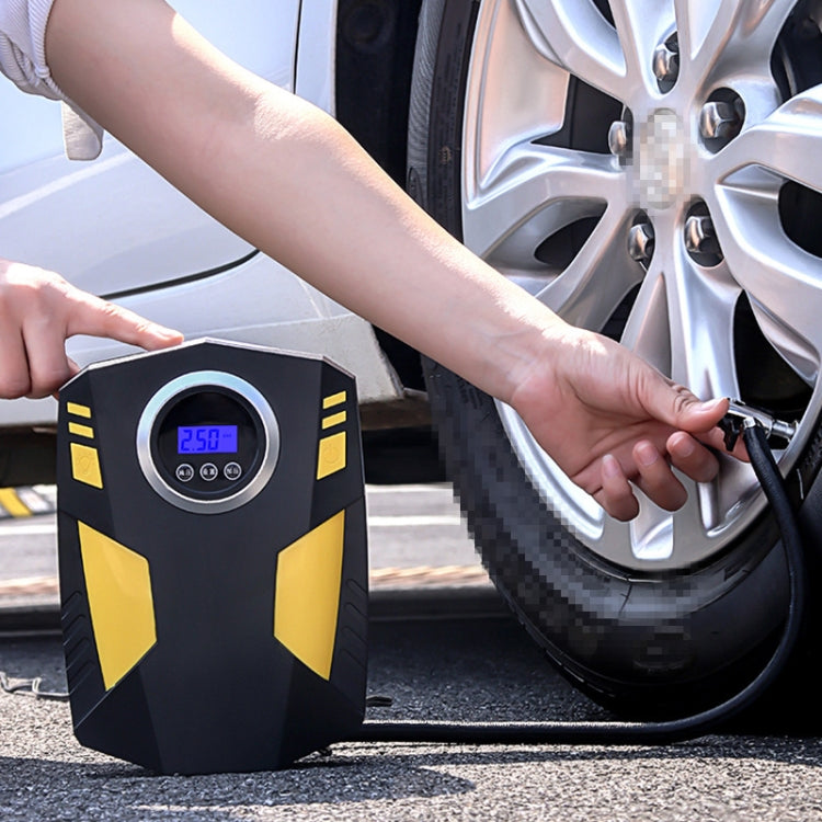 12V air pump connected to car tire valve with visible pressure screen