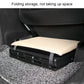 Adjustable car footrest ottoman with folded storage tray and light padded cushion