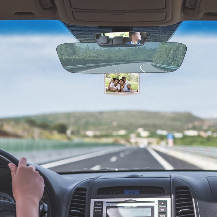 Blue rearview mirror with auxiliary display installed inside the car