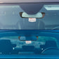 Blue-tinted rearview mirror with auxiliary display installed in rear cabin view