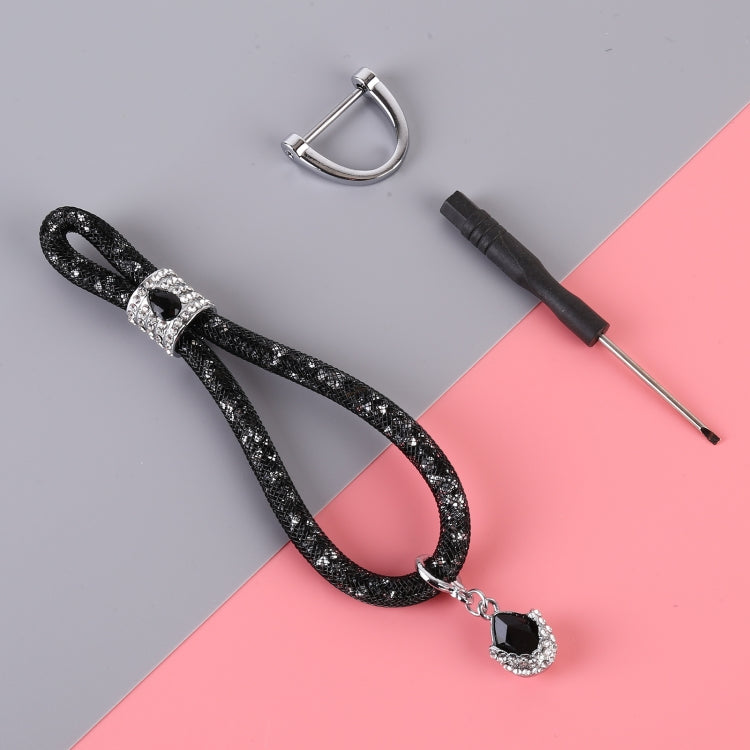 Black glitter car keychain with teardrop charm, silver ring and connector