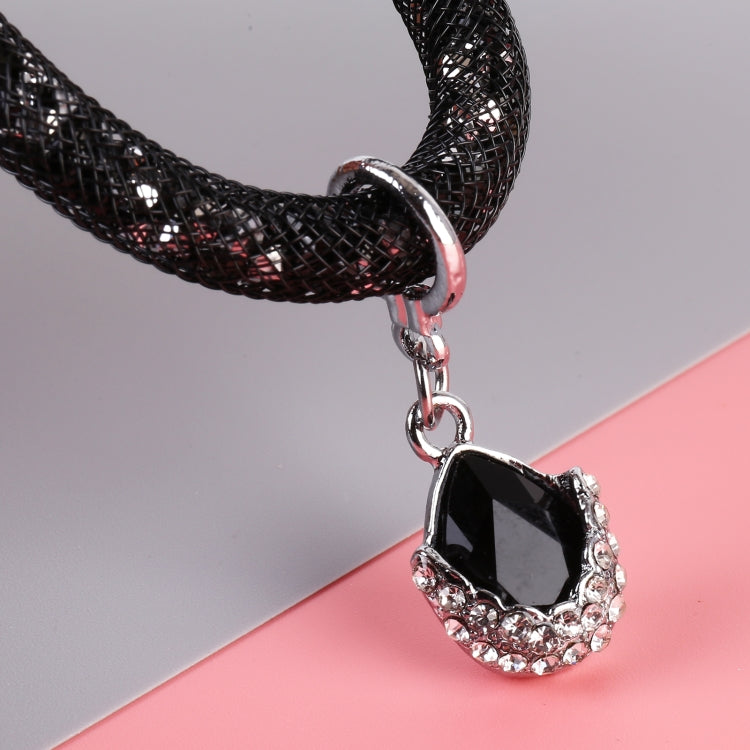 Black car keychain detail: silver clasp and black teardrop gem charm