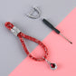 Red glitter car keychain with teardrop charm and silver ring connector