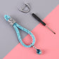 Baby blue glitter car keychain with blue teardrop charm and silver ring connector