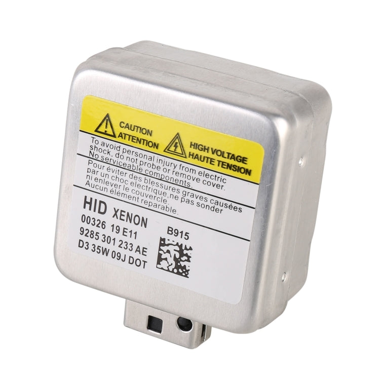 HID xenon bulb control module with silver casing, yellow warning label, and connector pins
