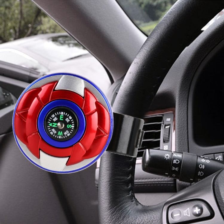 Red, blue, and black steering wheel spinner knob with compass dial and clamp