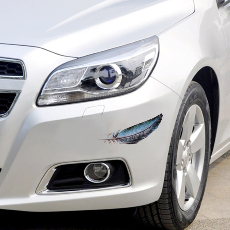 Feather car sticker near front bumper and headlight on a white car