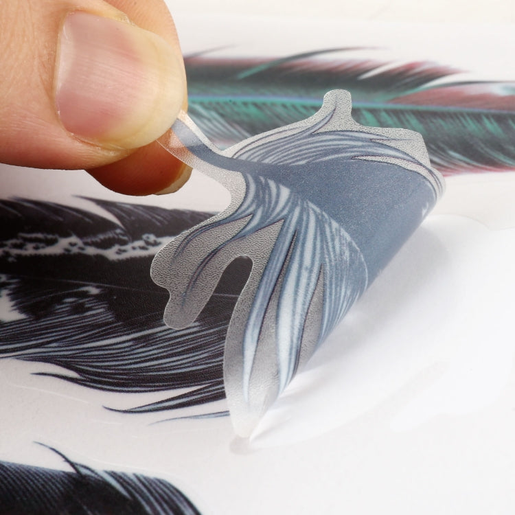 Blue and dark gray feather decal being applied on a car body surface