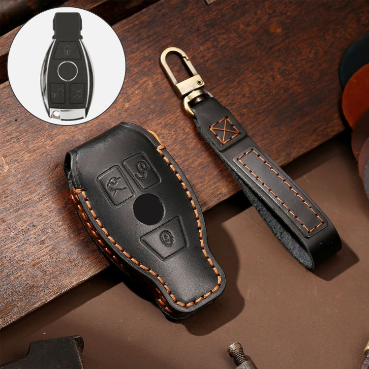 Black cowhide leather key fob case, button cutouts, orange contrast stitching
