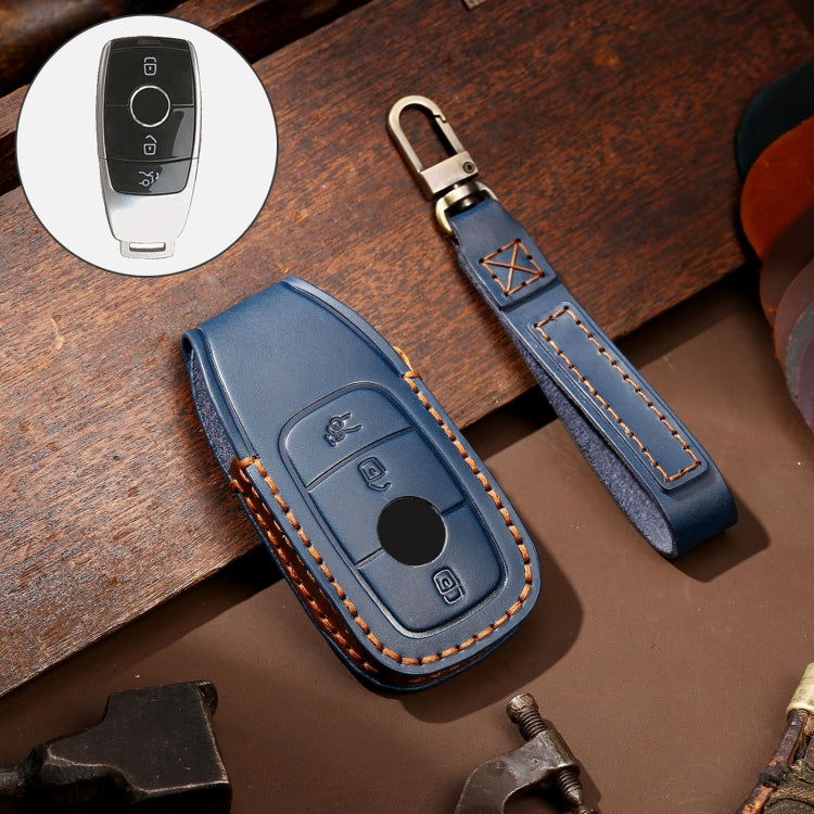 Blue leather key protective cover case with orange stitching and round button cutout