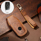 Brown leather key protective cover case with orange stitching and key fob button panel