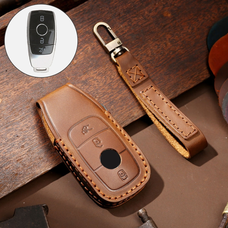 Brown leather key protective cover case with orange stitching and key fob button panel