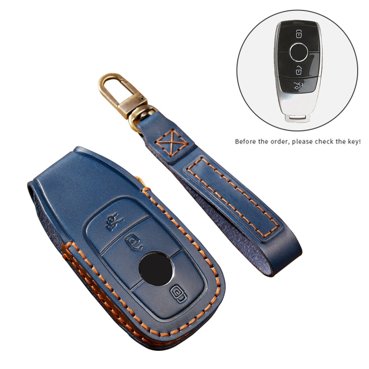 Set of blue leather key protective cover cases with key fob outline and orange stitching