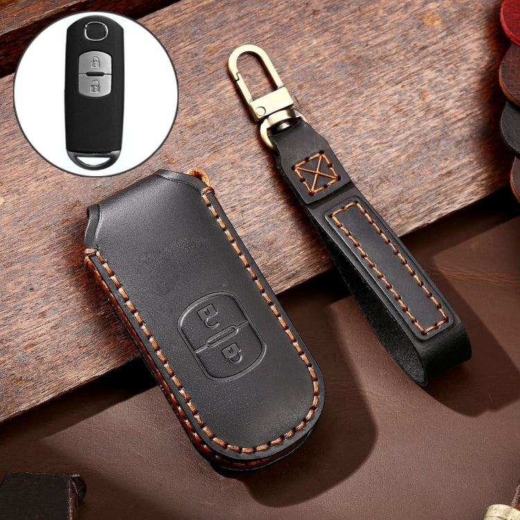Black leather key protective cover with button cutout and orange edge stitching