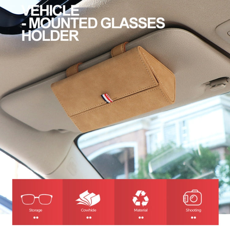 Beige glasses storage bag mounted in car ceiling with front emblem