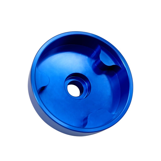Blue timing tool with central hole and machined slots for camshaft sprocket