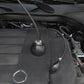 Inflatable leak plug and smoke tester hose mounted in car engine bay