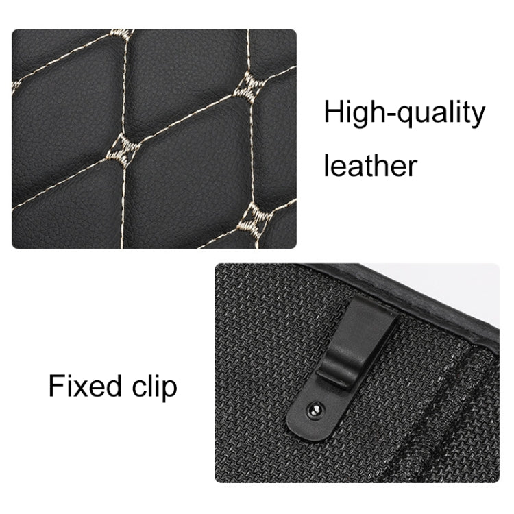 Black anti-kick mat detail: quilted leather-look surface with fixed clip