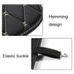 Black anti-kick mat with stitched edge and elastic strap buckle for attachment