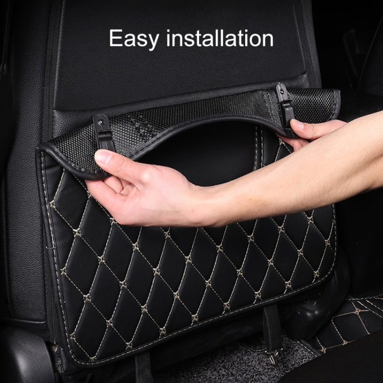 Car seat back anti-kick mat being installed with straps and buckles