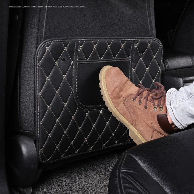 Car seat back anti-kick mat with diamond quilting; small shoe resting on it