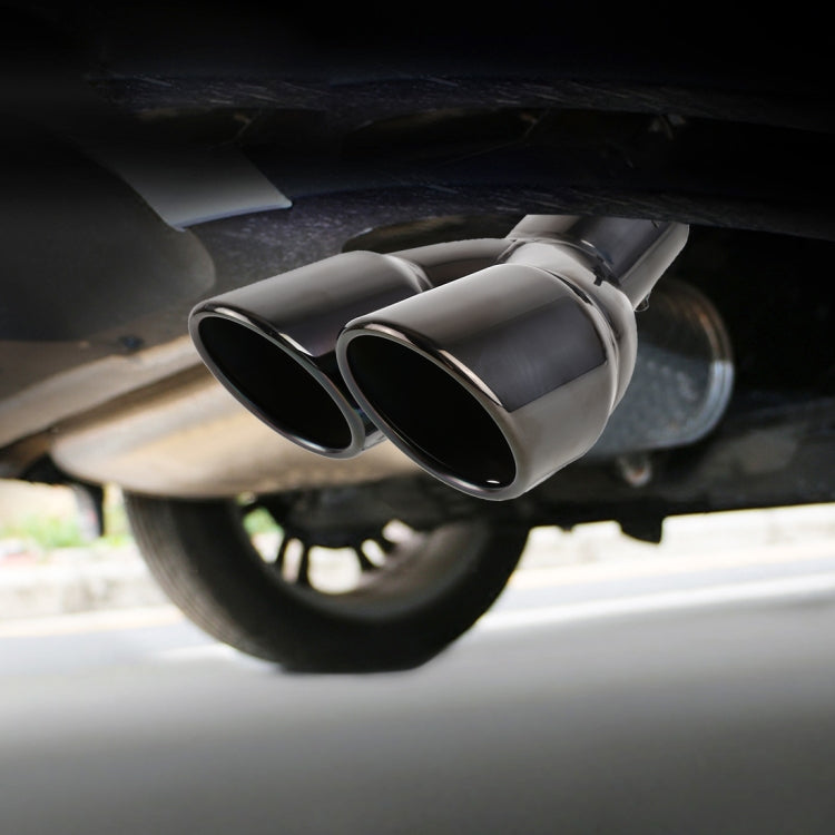 Installed stainless steel dual-oval exhaust tip with elbow pipe under rear bumper