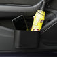 Car trash can bin filled with items including an umbrella and phone inside