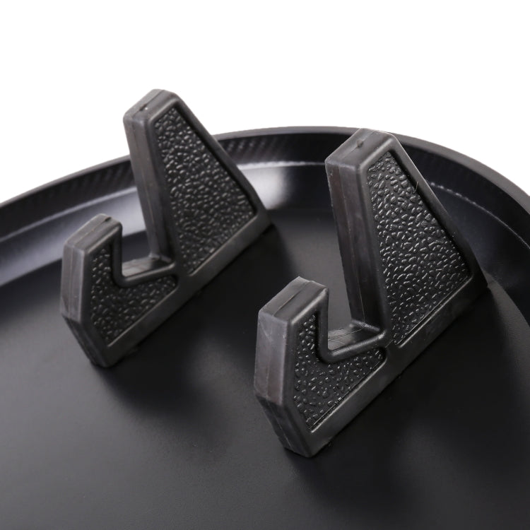 Black textured grips on car cup holder base for secure fit