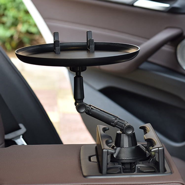 Black car cup holder mounted on seat console with round tray and phone stand