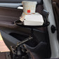 Black car cup holder on seat console holding cup and phone on tray