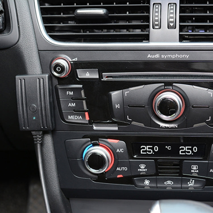 Car dashboard setup showing audio harness module connected near media controls