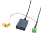 Multimedia audio cable interface module with black housing and green connector on wire