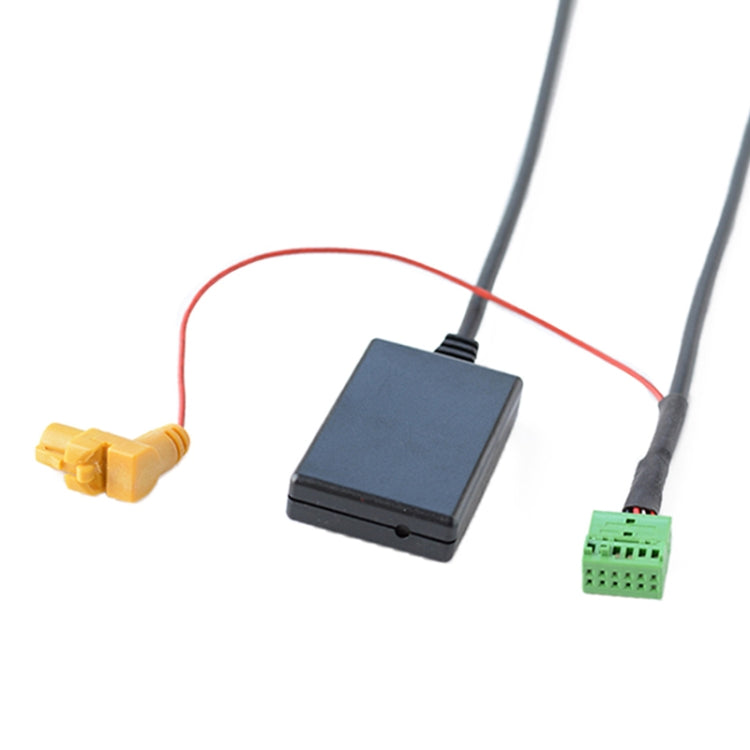 Multimedia audio cable interface module with black housing and green connector on wire