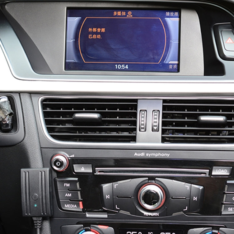 Car dashboard with the audio cable and microphone module near the infotainment area