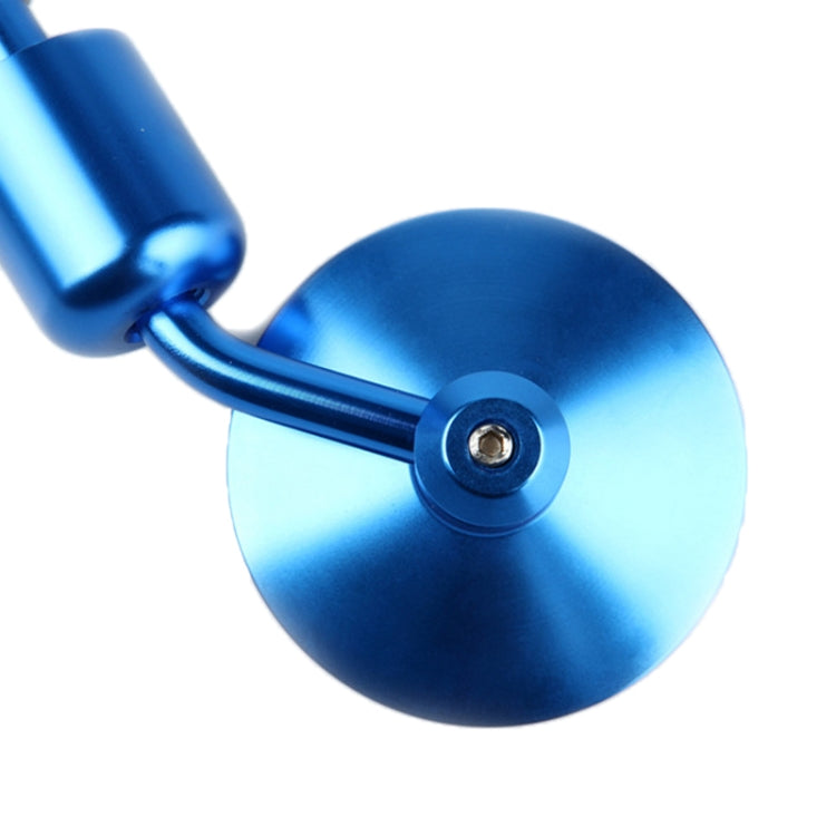 Close-up of blue round reflective motorcycle rearview mirror lens and mount