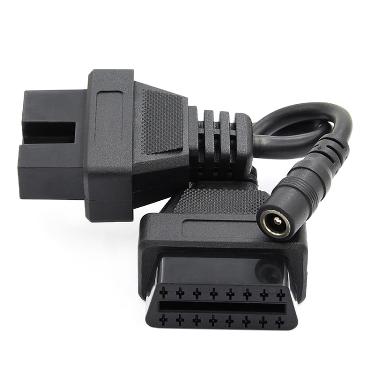 OBD2 adapter cable close-up of 12-pin and 16-pin connectors with audio-style round plug