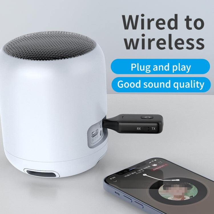 Black Bluetooth receiver/transmitter connected to a white wireless speaker