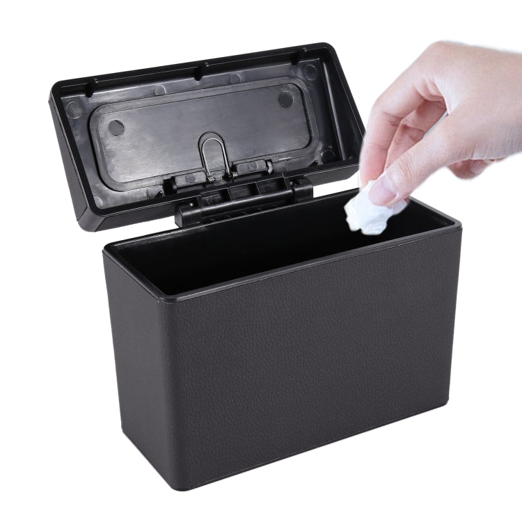 Car interior trash can with hinged lid, black plastic body and removable waste insert