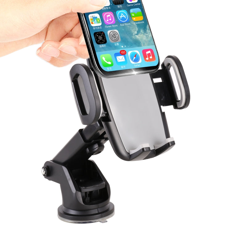 Car dashboard phone holder with black telescopic arms and side clamps, holding a phone