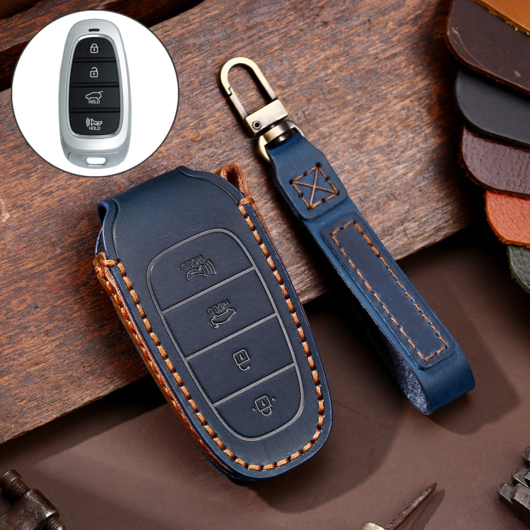 Blue cowhide leather key fob cover with 4-button insert and keyring, orange-stitched trim