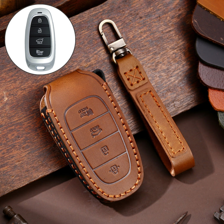 Brown cowhide leather key fob cover with 4-button insert and keyring, stitched border