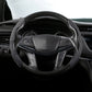 Black suede steering wheel cover, front view on a car wheel