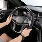 Black suede universal steering wheel cover being placed by hand
