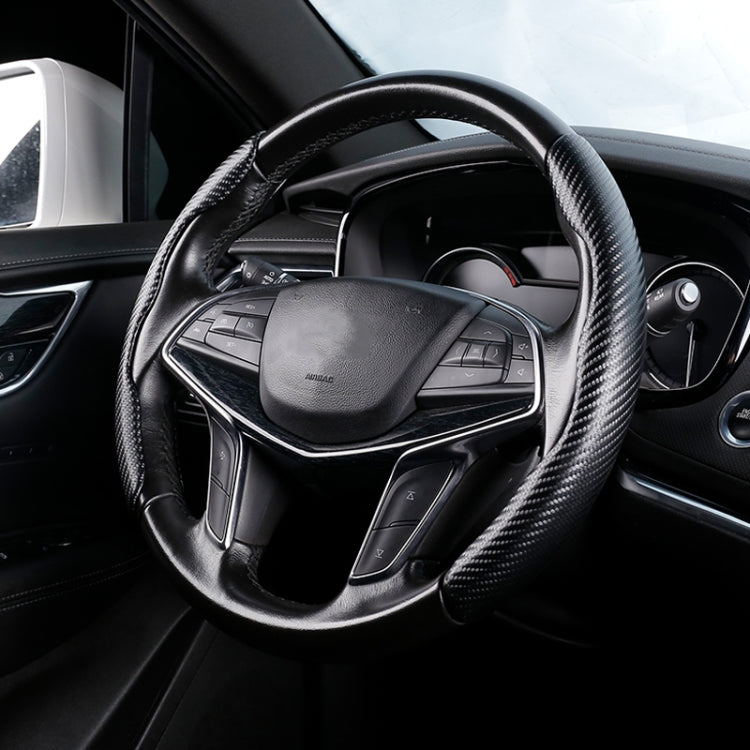 Black carbon-fiber texture steering wheel cover with stitched grip, universal fit.
