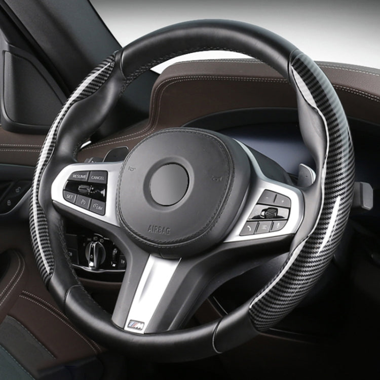 Black steering wheel cover with carbon fiber side panels and stitched edge