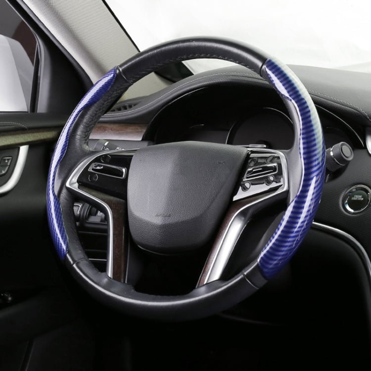 Blue carbon fiber steering wheel cover with black base and stitched grip