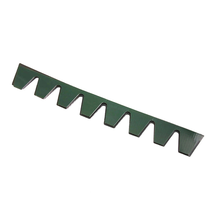 Green bumper guard strip with a line of tooth-like protective tabs