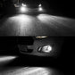 Car front with two H3 LED fog lights glowing bright white