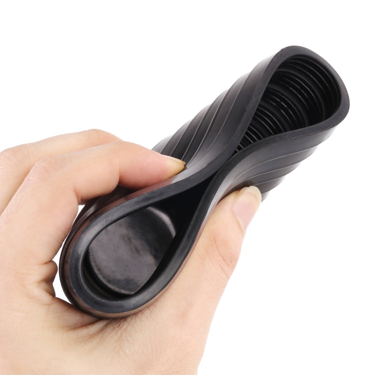 Hands holding black ribbed headlight dust cover, flexible soft rubber boot