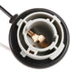 Reversing light holder socket close-up with copper terminals in black-and-white ring